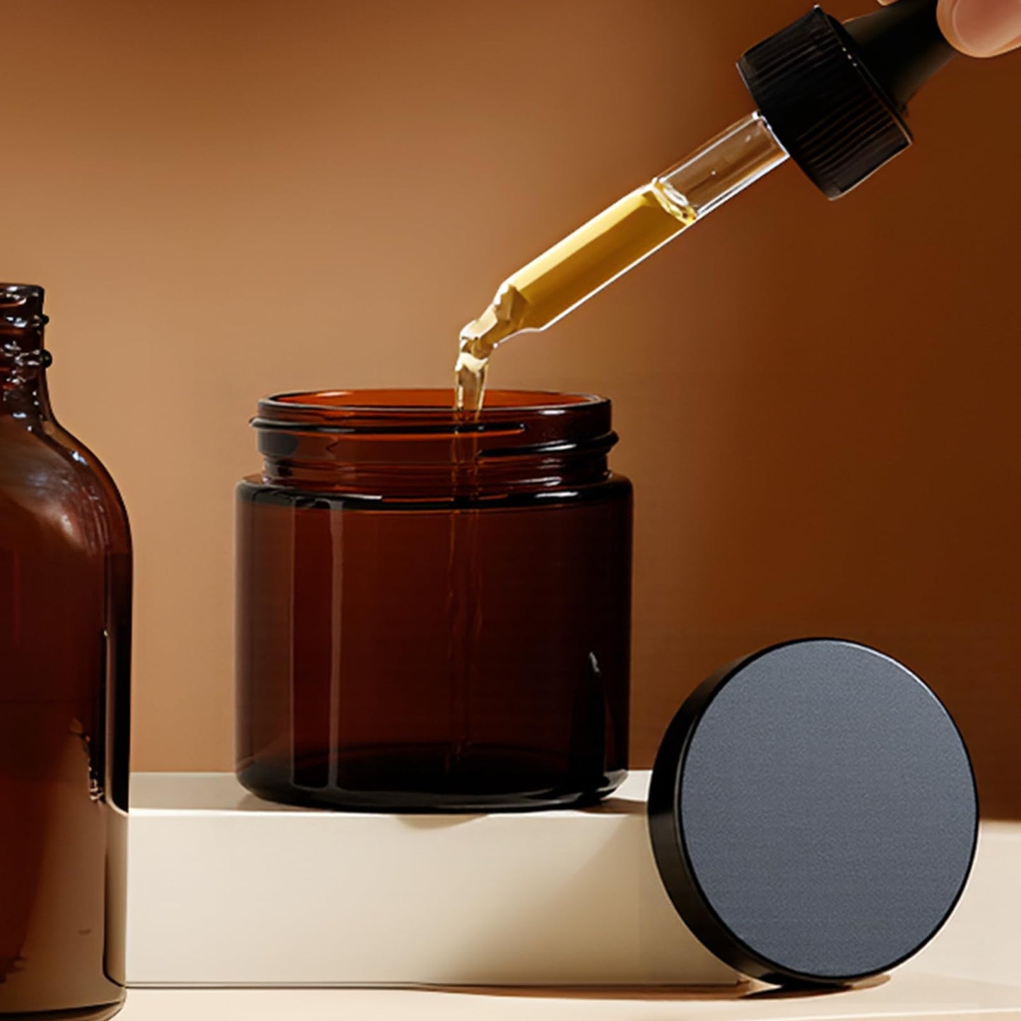 11 Hoa Kinh 2oz Jars with Lids 40 Pack Amber Glass Jars with Lids Empty Cosmetic Containers Round Airtight Glass Jar with Black Lid for Storing Lotions Powders Ointments