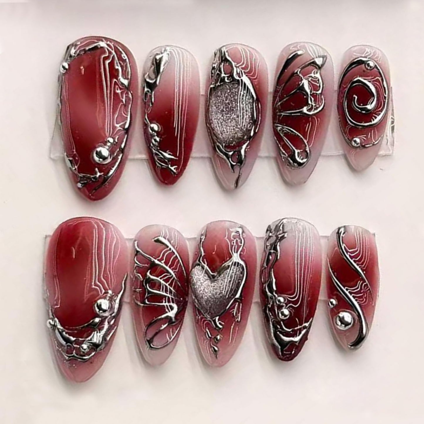 24Pcs Red Press on Nails Medium Almond Y2k Fake Nails with Silver Beads Irregular Chrome Lines Designs Red Artificial Nails Gothic Metallic Acrylic False Nails Full Cover Stick on Nails for Women
