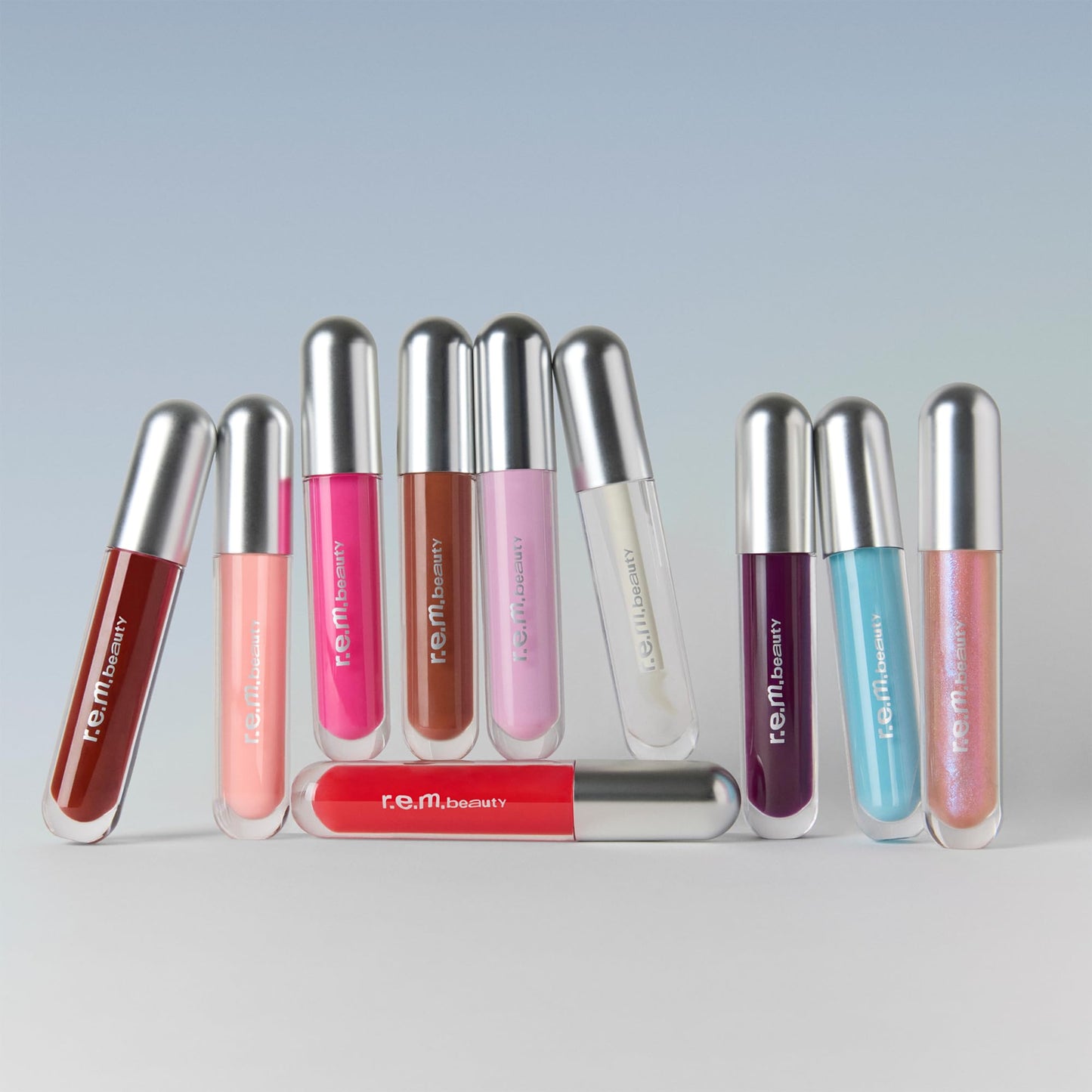 r.e.m. beauty by ariana grande | Essential Drip Glossy Balm in Juicebox | High Shine Nourishing Lip Balm | Hydrating Hyaluronic Acid | Smooth Glossy Finish